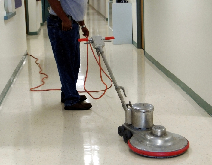 Tile floor being stripped and waxed