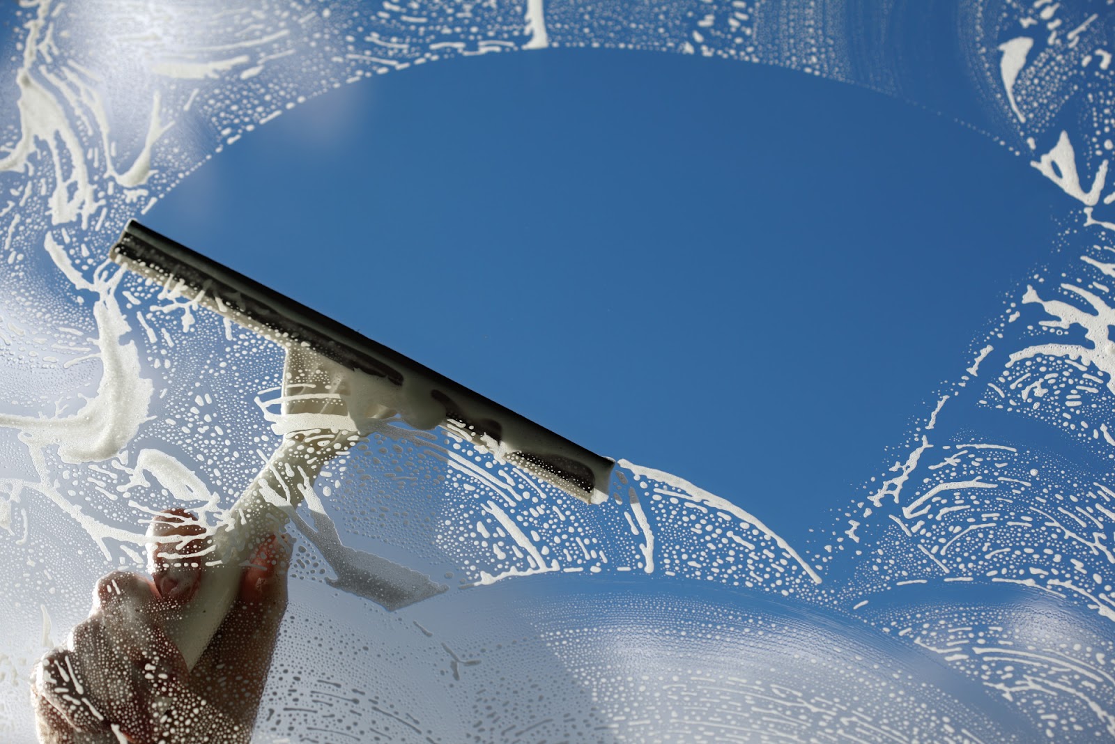Window washing on a Cache Valley home